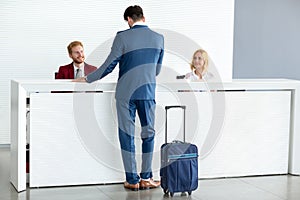 Receptionist wish welcome to guest photo