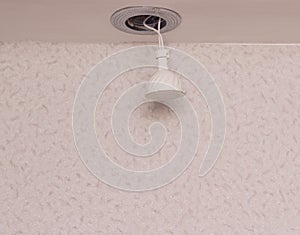 Recessed downlight with LED energy saving bulb, close-up, installation, copy space, modern