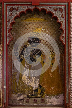Recessed Painting of Hindu Krishna within Mughal Window photo
