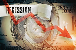Recession word under the torn dollar bill.  Economist forecast for the United States. Glowing red arrow going downwards on Benjami