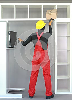 Recession.Worker in uniform ,putting  package on empty shelf