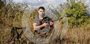 Recharge rifle concept. Hunting equipment and safety measures. Man with rifle hunting equipment nature background
