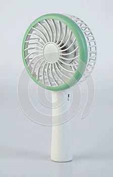 Rechargeable portable mini fan isolated on white