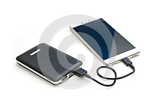 Recharging smart phone tablet from power bank photo