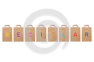 Reciclar recycle word write in different paper bags photo