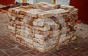 Recicling of red bricks. Old used redbricks ready to next use