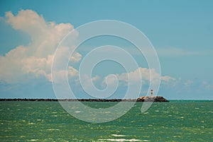 RECIFE, PERNAMBUCO, BRAZIL: Lighthouse on the horizon. Beautiful landscape with views of the rocks and turquoise sea