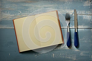 Recipe book with blank pages with fork and knife