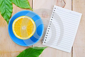 Recipe book with orange fruit