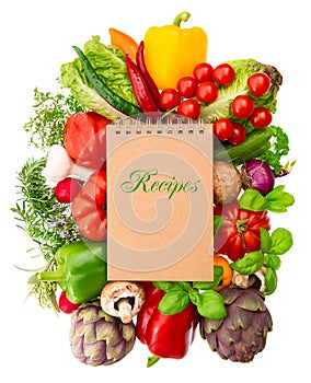 Recipe book with vegetables and herbs