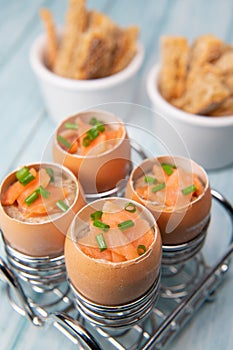 Recipe eggs casserole cooked in the shell with mushroom cream sauce and smoked salmon