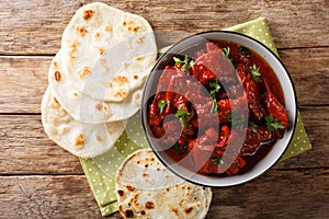 Recipe for Junglee Maas or Jungli Laal Maas close-up in the bowl. Horizontal top view