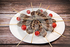 Recipe of kefta, beef skewer, Traditional homemade, with small tomatoes, Arabic and Libanese food