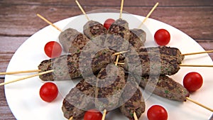 Recipe of kefta, beef skewer, Traditional homemade, with small tomatoes, Arabic and Libanese food