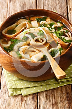 Recipe for Pancake or Crepe Soup Frittaten Suppe close-up in a plate. vertical