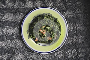 Recipe of spinach with in a dish. Healthy food, diets. Healthy food concept