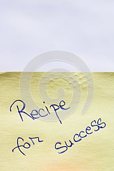 Recipe of success handwriting text close up isolated on yellow paper with copy space