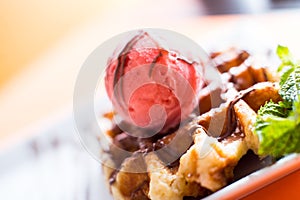 A waffle, also cited with the foreign words waffle, wafol, wafel or waffle, is a typical Belgian and northern French breakfast. photo