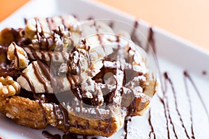 A waffle, also cited with the foreign words waffle, wafol, wafel or waffle, is a typical Belgian and northern French breakfast. photo