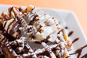 A waffle, also cited with the foreign words waffle, wafol, wafel or waffle, is a typical Belgian and northern French breakfast. photo