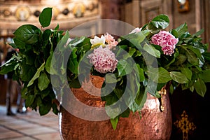 Recipient for Holy Water for Baptism ceremony. Flowers.