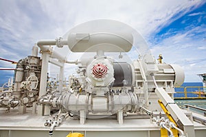 Reciprocating gas booster compressor at offshore oil and gas platform.