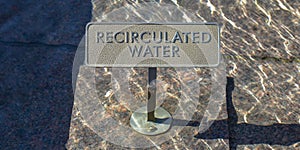 Recirculated water sign on glittering clear water