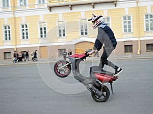 Reckless driver on a motor scooter.