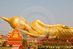 Reclined Buddha statue near Pha That Luang, a landmark of Vientiane