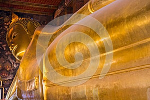 Reclining big Buddha gold statue