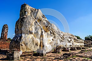 Reclining Buddha Ayutthaya perspective view with lotuses and ruins