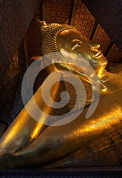 Reclining Buddha gold statue face