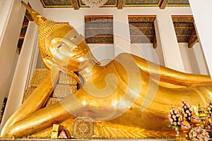 Reclining Buddha gold statue face. Wat Ratchaorotsaram, Bangkok,