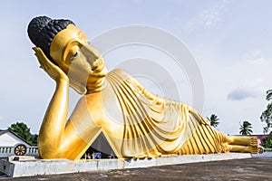 Reclining Buddha gold statue at Phuket, Thailand