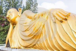 Reclining Buddha gold statue at Phuket, Thailand