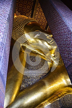 Reclining buddha gold statue. Wat Pho, Bangkok