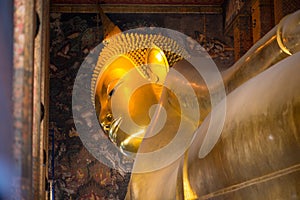 Reclining Buddha gold statue in Wat Pho, Bangkok, Thailand