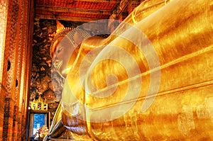 Reclining Buddha gold statue. Wat Pho, Bangkok, Thailand