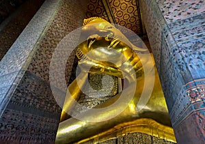 Reclining buddha golden statue In Wat Phra Chetuphon - Thailand Landmark