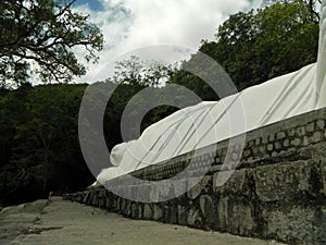 Reclining Buddha from the side of the legs