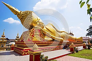 Reclining Buddha Statue at Wat Pha That Luang, Vientiane, Laos photo