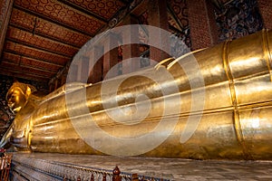 Reclining Buddha statue in Wat Pho, a famous Buddhist temple complex in Bangkok, Thailand