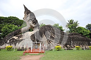Reclining Buddha Statue in Wat Xieng Khuan Buddha park.