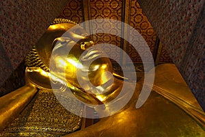 Reclining buddha Wat Pho in Bangkok Thailand.