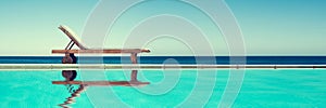Reclining chair near a swimming pool, travel panoramic background