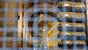 reclining golden buddha statue at wat pho in Bangkok, Thailand