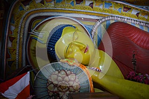 Reclining statue of Buddha in the rock temple of the Isurumuniya Monastery, Anuradhapura, Sri Lanka