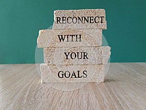 Reconnect with your Goals symbol. Brick blocks with words Reconnect with your goals.