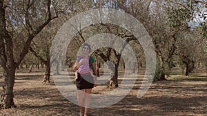 Reconnecting with nature reduces stress and calms nerves. Woman with baby.