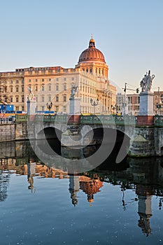 The reconstructed City Palace and a small canal photo